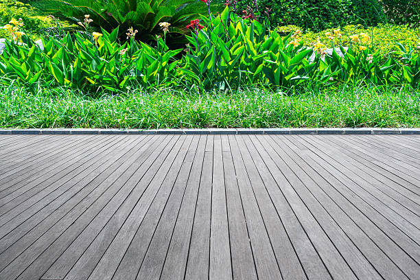istock Empty boardwalk in the lush green garden 2222541022