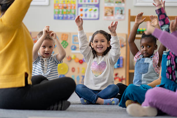 istock Children Enjoying Interactive Activities in a Colorful Classroom Setting 2222541676