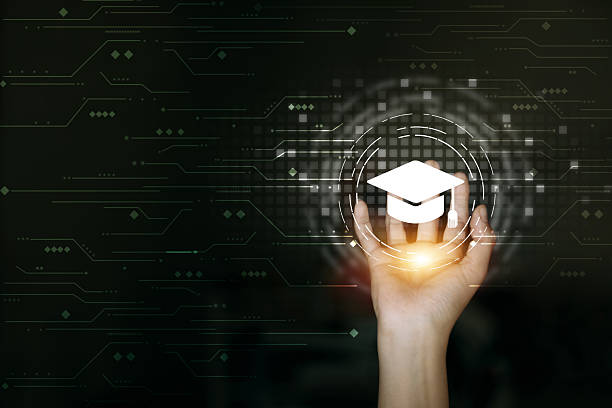 istock A hand holds a holographic graduation cap, symbolizing digital learning 2222545191