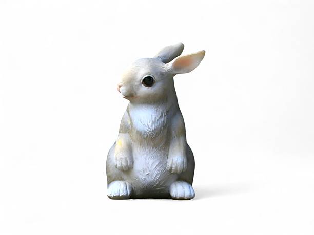 istock A cute grey rabbit figurine on a white background 2222549006