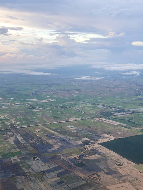 istock Aerial view of colorful patchwork of fields and meadows under a cloudy sky 2222553348