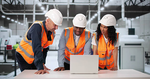 istock Inspecting Automated Manufacturing Process In Factory. Diverse Team 2222555725