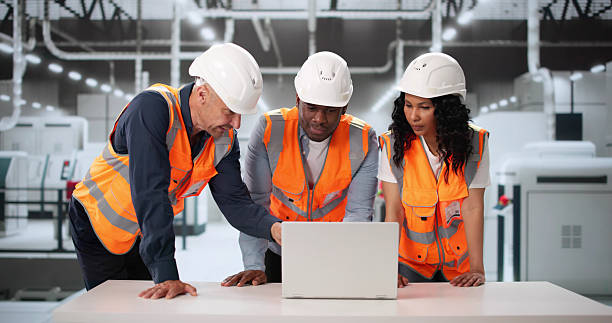 istock Multiethnic Team Examining High-Tech Production Line 2222555728