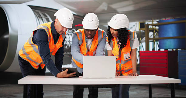 istock Multiracial Aviation Team Checking Aircraft Safety In Hangar 2222555729