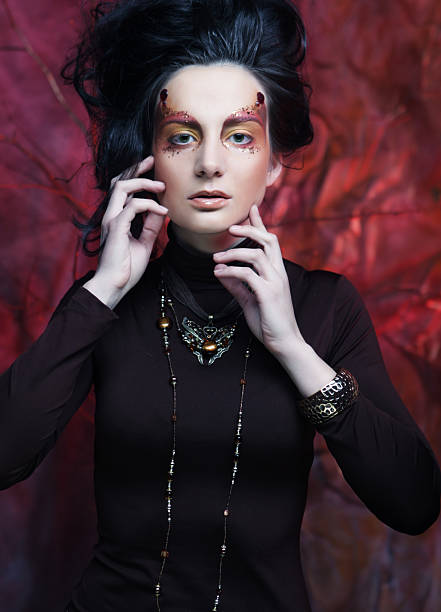 istock Beautiful brunette woman with bright creative make up 2222558008