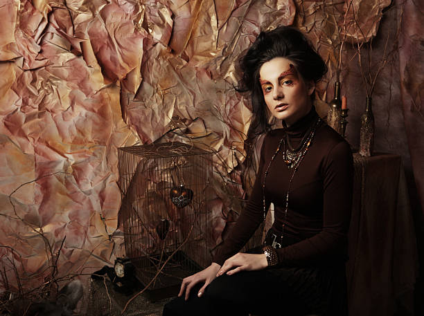 Young woman in vintage attire sits by an old green door, surrounded by luggage, evoking a nostalgic travel scene.