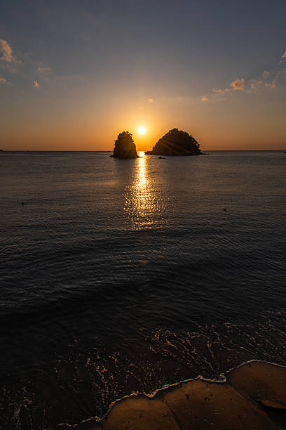 istock sunset over the sea and rocks 2222558253
