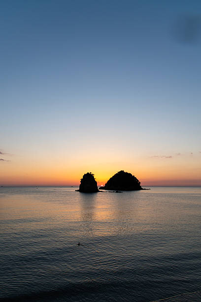 istock sunset over the sea and rocks 2222558441