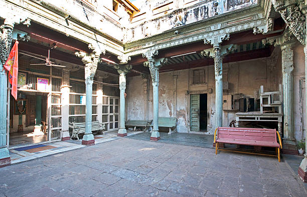 Pillared courtyard, Old Town, Ahmedabad, Gujarat, India. Ahmedabad is the largest city in Gujarat, once home to Gandhi the spiritual leader. Also known for the Calico Museum of Textiles, once a cloth merchant's mansion, with a collection of antique and modern fabrics. Gujarat, the north western state of India,  encompasses part of site of the Indus Valley civilisation, the oldest known to mankind and is also home to some of the most historic sites and religious locations in India. The Rann of Kutch is famous for its arid desert like landscapes as well as wildlife such as the Wild Ass, together with Gir Forest, home to the only Asiatic Lions in the continent.