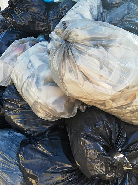 istock trash bags near the dumpster 2222560269