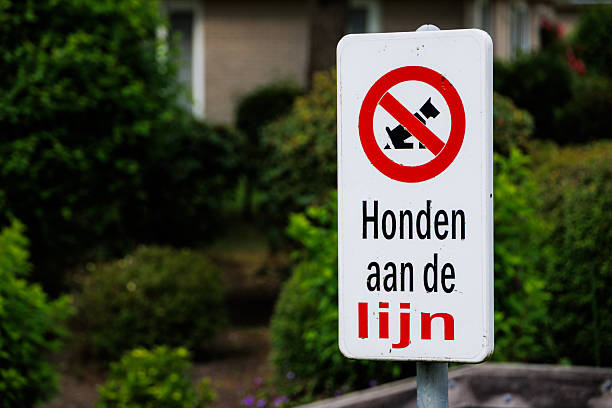 A typical 'No Dogs Allowed' sign, urging dog owners to keep pets leashed, located in the Netherlands.