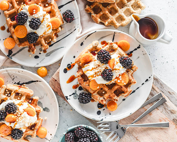 istock Waffle spread with yoghurt, berries and syrup 2222569470