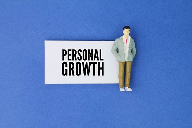istock Miniature people and paper with the word personal growth. the ongoing process of developing oneself by improving skills, behaviors, attitudes, and understanding of oneself and the world 2222573094