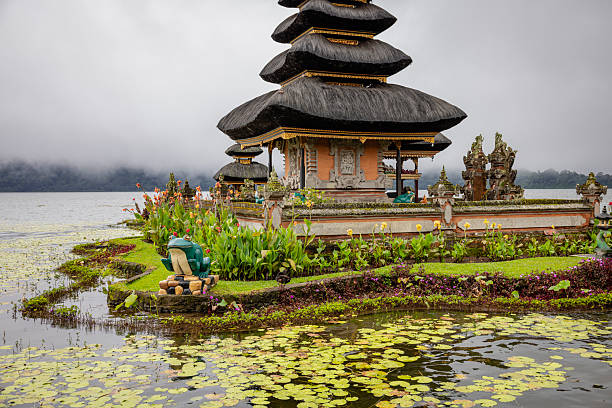 Pura ulun danu bratan temple with flower bed in foreground. Bali, Indonesia.