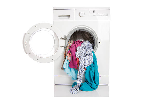 istock Washing machine with clean linen on a white background... 2222575622