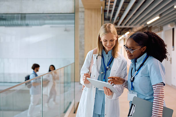 istock Happy female medical student using digital tablet at the university. 2222581588