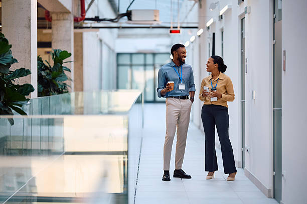 istock Happy black entrepreneurs communicating during their coffee break at work. 2222583487