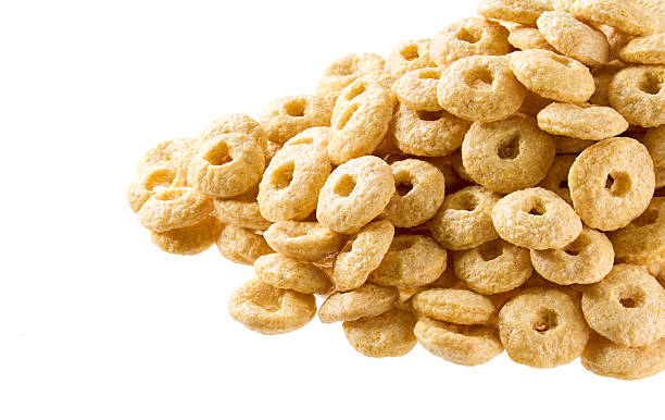 istock Whole grain cereal rings in a white background, close up. Crispy cereal loops in a white background. 2222587525