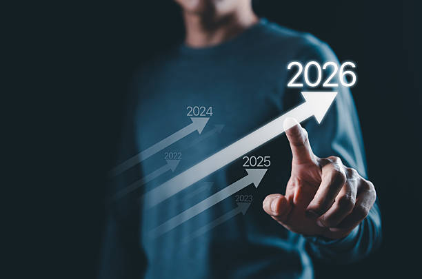 istock Business growth strategy towards 2026 Concept. Person points at arrow 2026, with progress arrows from previous years, symbolizing business growth, planning future for achieving success and milestones. 2222587916