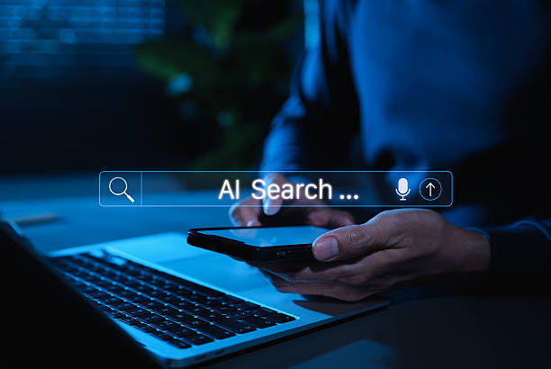 istock AI search engine technology concept. Man use smartphone with AI search bar interface representing artificial intelligence search technology, voice input, and innovation in modern information retrieval 2222587919