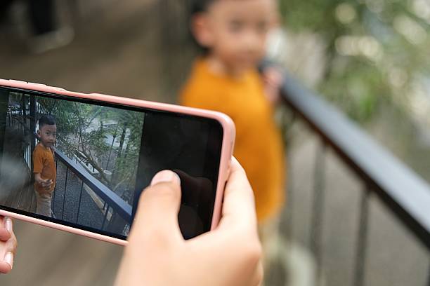 istock Taking a Portrait of a Boy Using a Smartphone 2222588619