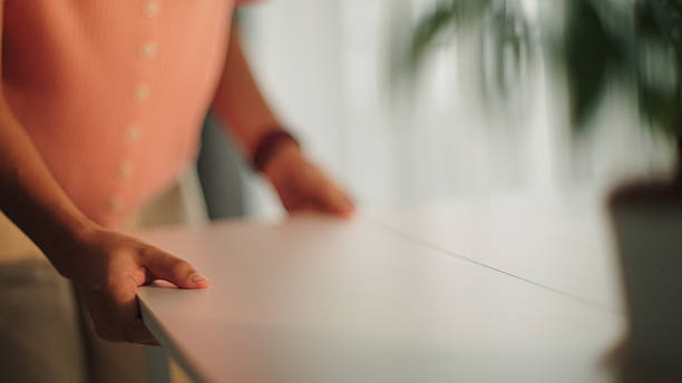 istock Teenager arranging the workspace at home. 2222589554