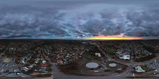 istock Hackham West, South Australia: 360 Aerial Panorama at Sunset Showcasing Suburban Layout, Distant Coastline, and Dramatic Storm Clouds 2222591083