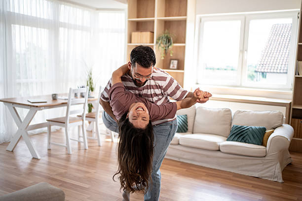 istock Happy couple dancing and having fun at home 2222591492