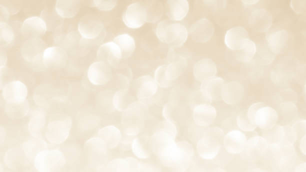 istock Golden yellow beige cream and white light glitter bokeh texture background. 2222591621