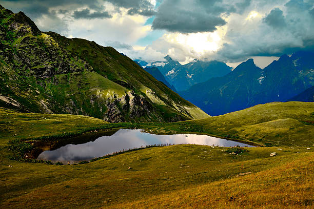 Mountain ranges on a sunny day at Georgia. Sky with clouds adn hills