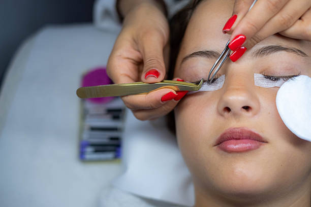 istock girl in salon getting eyelash treatment 2222601060