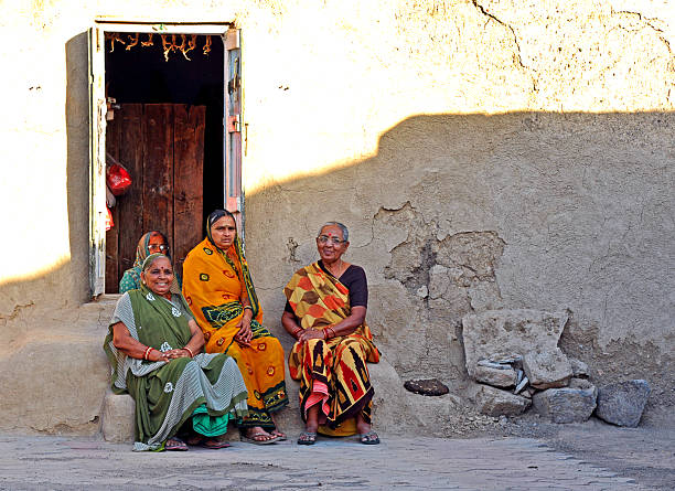Old women sitting in shade on step, Dared, Punjab, India. The Punjab, is the state which is the heart of India’s Sikh community, bordering Pakistan. The city of Amritsar is best known for Harmandir Sahib, the holiest gurdwara, or Sikh place of worship and a major pilgrimage site. The distinctive Golden Temple, as it is known in English, is surrounded by the Pool of Nectar.