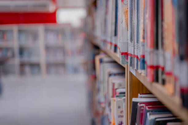 istock Explore Cozy Bookstore Corner Captivating Image Of Bookshelves With Colorful Spine Array In Daytime Discover History Within Each Chapter, Beautifully Displayed Against Wooden Background 2222601801