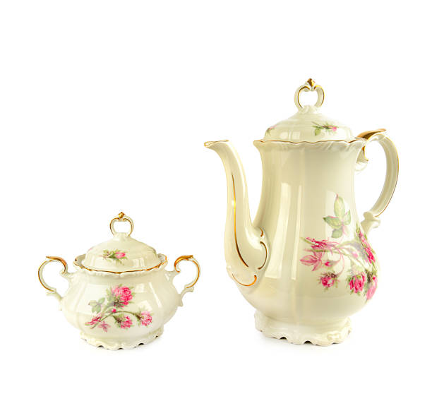 istock Porcelain vintage coffee pot and sugar bowl isolated on white. 2222604049