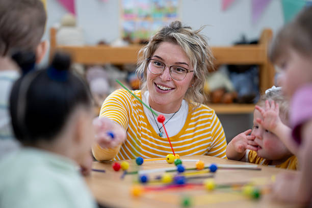 istock Teacher Engaging Preschoolers in Creative Activities with Colorful Learning Materials 2222606833