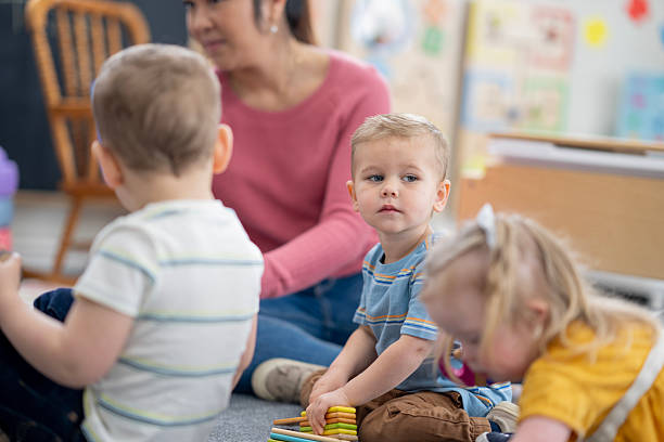 istock Group of Young Children Socializing and Playing in a Friendly Classroom Setting 2222606992