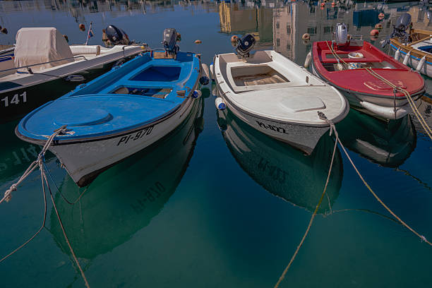 Istanbul, Turkey - February 10, 2019: Fishing boats on kucukcekmece lake. The are lots of people on the boats and near the lake. Lake is 20 kilometers west of the city center on the shores of the Sea of Marmara, having an area of 16 square kilometers.