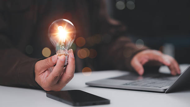 istock Bright Idea Blooms Person Holds Glowing Lightbulb, Future Innovation 2222608582