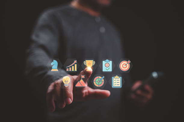 istock Hand Reaching Modern Tech Strategy To Target Mountain Flag Achievement 2222609169