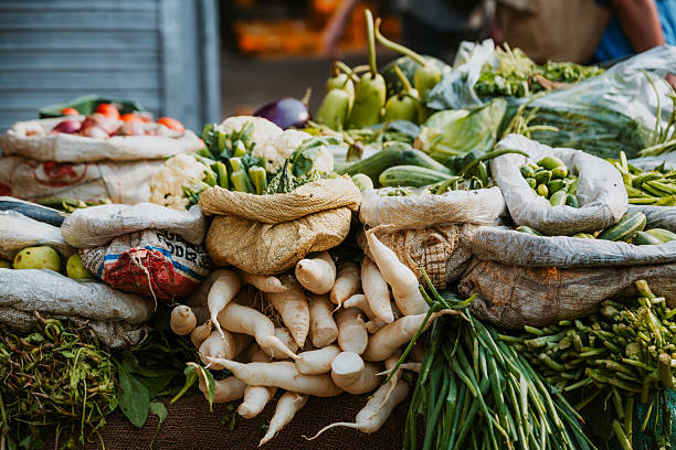 istock Colorful Produce Stall Displaying Fresh Vegetables at a Local Market Setting 2222609189