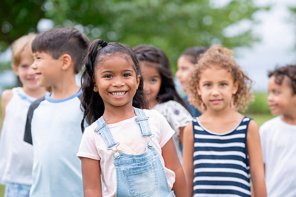 istock Multicultural Group of Happy Children Smiling Outdoors in a Park Setting 2222612782