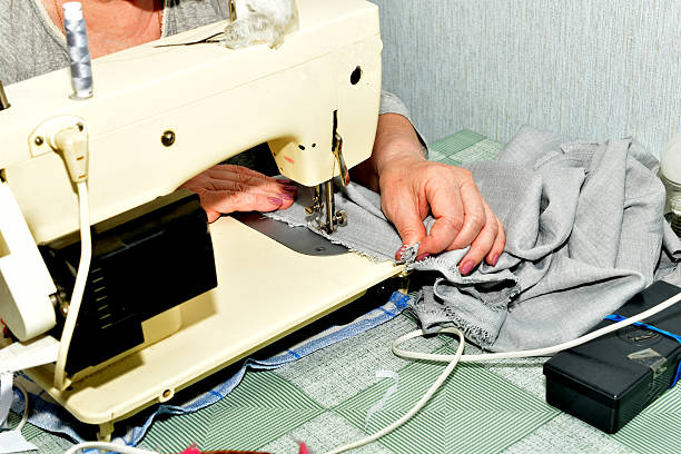 istock The seamstress sews on a sewing machine. 2222615313
