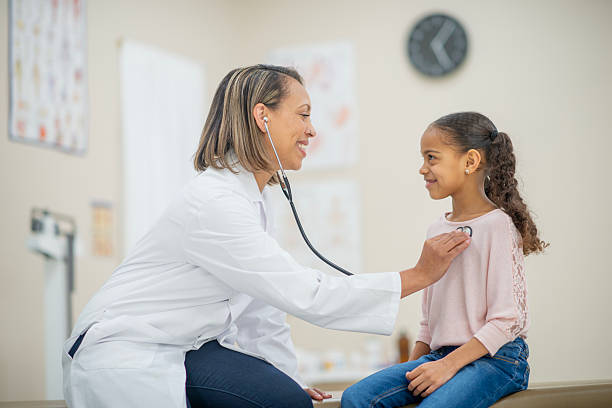 istock Pediatrician Examining Smiling Child Using Stethoscope in a Medical Office 2222617140