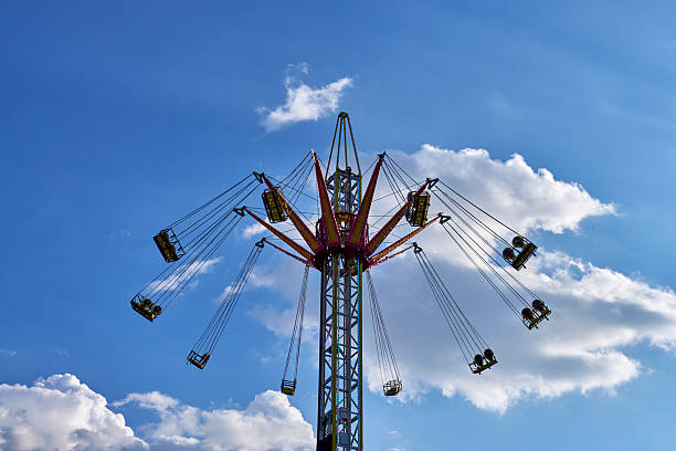 istock Flying swings spinning at the Cholula fair 2222618455