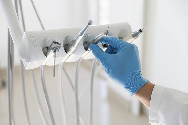 istock Dental Instruments and Gloved Hand in Modern Clinic 2222620309