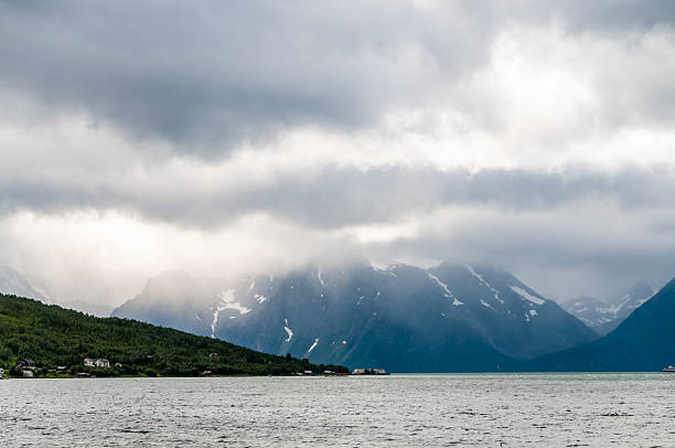Impressive clouds hanging low over a fjord in  Northern Norway.