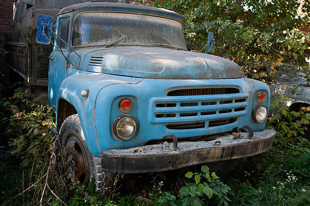 Broken abandoned rusty old vehicle. Retro damaged transportation.