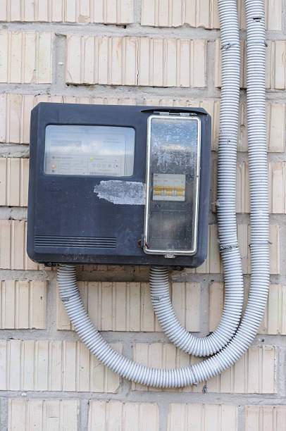 istock electricity meter on the brick wall with copy space for add text 2222630912