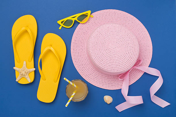 istock Flat lay with colorful beach accessories on color background. Vacation concept 2222633836