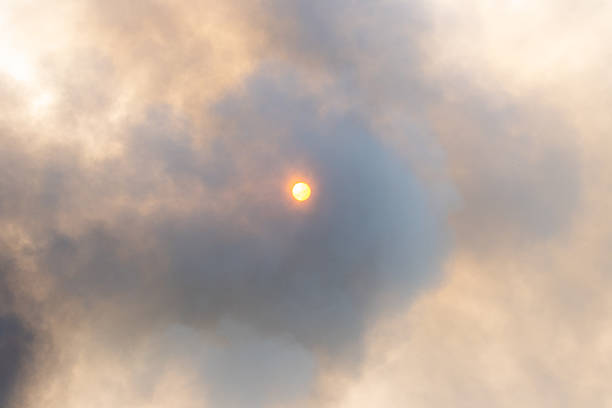 Sun partially hidden behind thick smoke, non-standard situation
